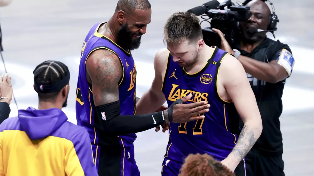 Apr 9, 2025; Dallas, Texas, USA; Los Angeles Lakers forward LeBron James (23) celebrates with Los Angeles Lakers guard Luka Doncic (77) during the fourth quarter against the Dallas Mavericks at American Airlines Center. Mandatory Credit: Kevin Jairaj-Imagn Images