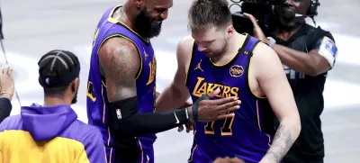 Apr 9, 2025; Dallas, Texas, USA; Los Angeles Lakers forward LeBron James (23) celebrates with Los Angeles Lakers guard Luka Doncic (77) during the fourth quarter against the Dallas Mavericks at American Airlines Center. Mandatory Credit: Kevin Jairaj-Imagn Images