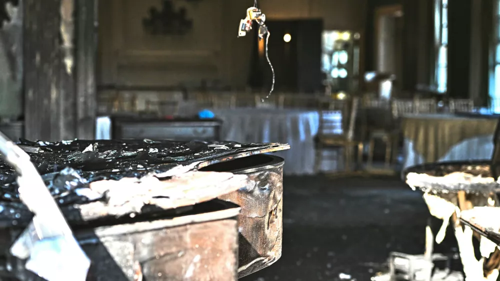 A charred piano, left, is visible inside the Pennsylvania governor's official residence after a man was arrested in the alleged arson that forced Gov. Shapiro, his family and guests to flee in the middle of the night on the Jewish holiday of Passover, Sunday, Apr. 13, 2025, in Harrisburg, Pa. (AP Photo/Marc Levy)
