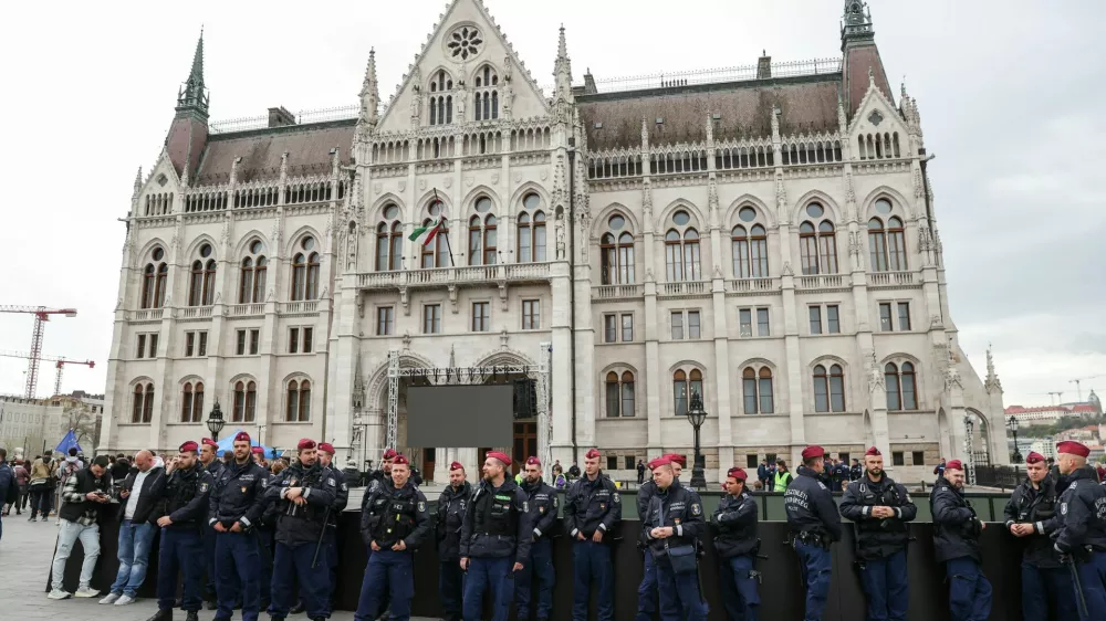 Police officers stand guard in front of the Parliament building, on the day the Hungarian Parliament votes on constitutional amendments targeting LGBTQ community, Budapest, Hungary, April 14, 2025. REUTERS/Bernadett Szabo