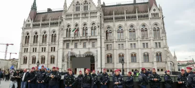 Police officers stand guard in front of the Parliament building, on the day the Hungarian Parliament votes on constitutional amendments targeting LGBTQ community, Budapest, Hungary, April 14, 2025. REUTERS/Bernadett Szabo