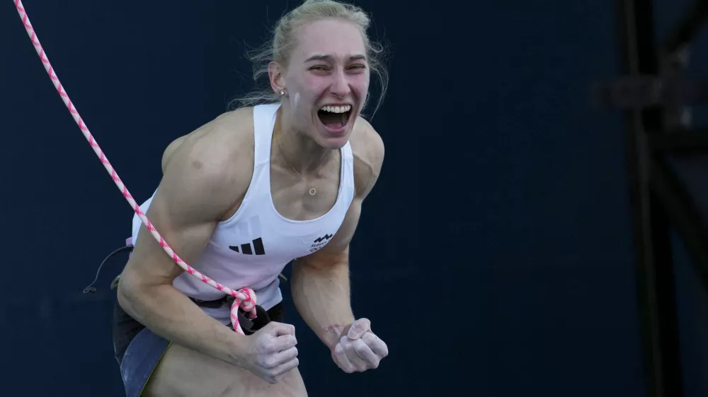Janja Garnbret of Slovenia reacts after winning the gold during the women's boulder and lead final for the sport climbing competition at the 2024 Summer Olympics, Saturday, Aug. 10, 2024, in Le Bourget, France. (AP Photo/Tsvangirayi Mukwazhi)