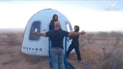 Jeff Bezos stands as Lauren Sanchez comes out of the capsule in which she, pop star Katy Perry, journalist Gayle King, and other participants, landed back on earth after blasting off into space on a Blue Origin rocket, as part of the New Shepard Mission NS-31, marking the first all-female flight crew in more than six decades, in West Texas, Texas, U.S., April 14, 2025, in this screen grab taken from a video. Blue Origin/Handout via REUTERS  THIS IMAGE HAS BEEN SUPPLIED BY A THIRD PARTY. NO RESALES. NO ARCHIVES. MANDATORY CREDIT   TPX IMAGES OF THE DAY