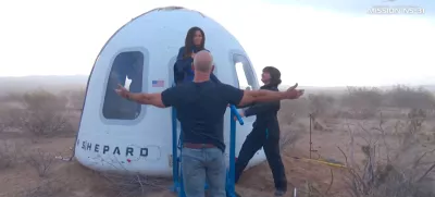 Jeff Bezos stands as Lauren Sanchez comes out of the capsule in which she, pop star Katy Perry, journalist Gayle King, and other participants, landed back on earth after blasting off into space on a Blue Origin rocket, as part of the New Shepard Mission NS-31, marking the first all-female flight crew in more than six decades, in West Texas, Texas, U.S., April 14, 2025, in this screen grab taken from a video. Blue Origin/Handout via REUTERS  THIS IMAGE HAS BEEN SUPPLIED BY A THIRD PARTY. NO RESALES. NO ARCHIVES. MANDATORY CREDIT   TPX IMAGES OF THE DAY