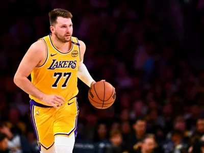 FILE PHOTO: Apr 11, 2025; Los Angeles, California, USA; Los Angeles Lakers guard Luka Doncic (77) moves the ball against the Houston Rockets during the first half at Crypto.com Arena. Mandatory Credit: Jonathan Hui-Imagn Images/File Photo