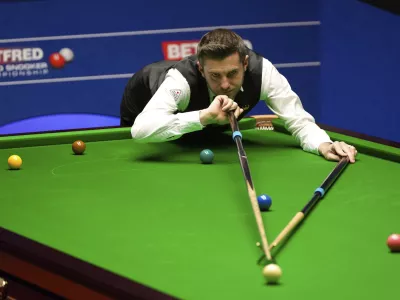 England's Mark Selby plays a shot on the way to winning the World Snooker Championships at the Crucible Theatre in Sheffield, England, Monday, May 3, 2021. (Zac Goodwin/PA via AP)
