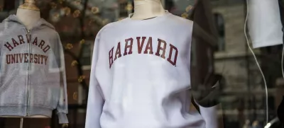 Harvard sweatshirts are displayed for sale in a school store window on the Harvard University campus in Cambridge, Massachussetts, on April 15, 2025. Elite US university Harvard was hit with a .2 billion federal funding freeze on April 14 after rejecting a list of sweeping demands that the White House said was intended to crack down on campus anti-Semitism. The call for changes to its governance, hiring practices and admissions procedures expands a list Harvard received on April 3, which ordered officials to shut diversity offices and cooperate with immigration authorities for screenings of international students. In a letter to students and faculty, Harvard president Alan Garber vowed to defy the government, insisting that the school would not "negotiate over its independence or its constitutional rights.",Image: 988277045, License: Rights-managed, Restrictions:, Model Release: no