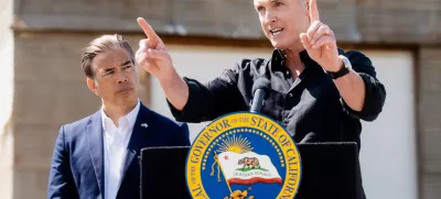 California Gov. Gavin Newsom discusses President Donald Trump's tariffs, as California Attorney General Rob Bonta, left, listens, during a press conference on Wednesday, April 16, 2025, at an almond farm in Ceres, Calif. (AP Photo/Noah Berger)