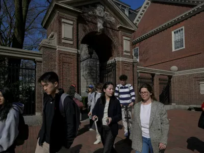 Students walk on the campus of Harvard University in Cambridge, Massachusetts, U.S., April 15, 2025.  REUTERS/Faith Ninivaggi