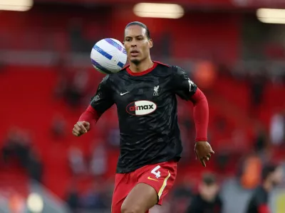 FILE PHOTO: Soccer Football - Premier League - Liverpool v Everton - Anfield, Liverpool, Britain - April 2, 2025 Liverpool's Virgil van Dijk during the warm up before the match REUTERS/Phil Noble EDITORIAL USE ONLY. NO USE WITH UNAUTHORIZED AUDIO, VIDEO, DATA, FIXTURE LISTS, CLUB/LEAGUE LOGOS OR 'LIVE' SERVICES. ONLINE IN-MATCH USE LIMITED TO 120 IMAGES, NO VIDEO EMULATION. NO USE IN BETTING, GAMES OR SINGLE CLUB/LEAGUE/PLAYER PUBLICATIONS. PLEASE CONTACT YOUR ACCOUNT REPRESENTATIVE FOR FURTHER DETAILS../File Photo