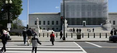 FILE PHOTO: People walk near the U.S. Supreme Court building in Washington, D.C., U.S., April 8, 2025. REUTERS/Jonathan Ernst/File Photo