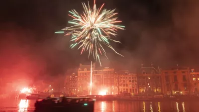 AJAX supporters celebrate the 125th anniversary of the football club. Thousands of fans of the historic Dutch FC travel and gather in Amsterdam, the Netherlands, on March 18, 2025, to march through the city and set up fireworks and flares while chanting their favorite slogans. The fans walk until the Amstel River where they set up a show with multiple fireworks lighting up the night sky of the capital. (Photo by Gene Medi/NurPhoto)NO USE FRANCE