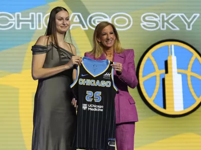 Ajsa Sivka, left, poses for a photo with WNBA commissioner Cathy Engelbert after being selected 10th overall by the Chicago Sky during the first round of the WNBA basketball draft, Monday, April 14, 2025, in New York. (AP Photo/Pamela Smith)