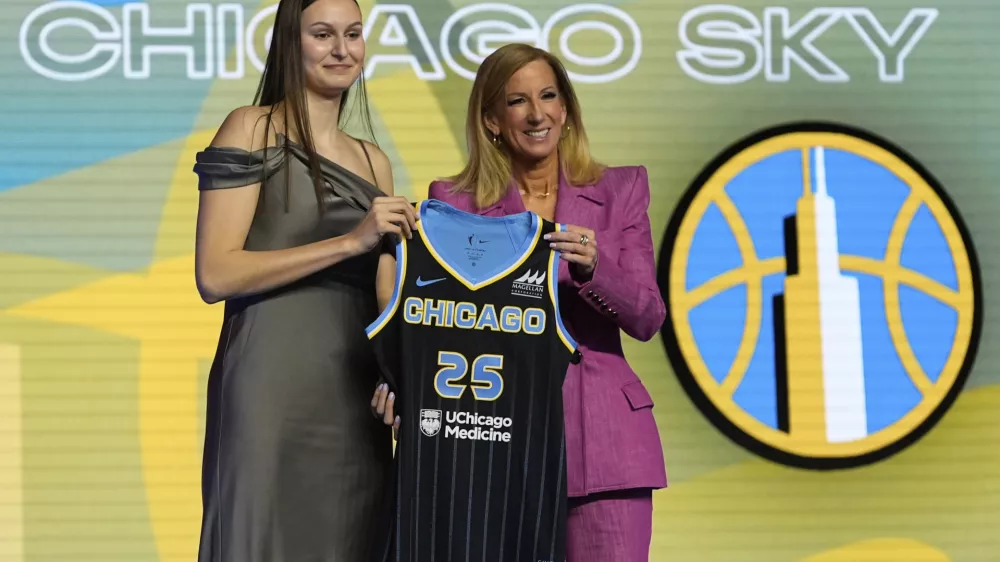 Ajsa Sivka, left, poses for a photo with WNBA commissioner Cathy Engelbert after being selected 10th overall by the Chicago Sky during the first round of the WNBA basketball draft, Monday, April 14, 2025, in New York. (AP Photo/Pamela Smith)