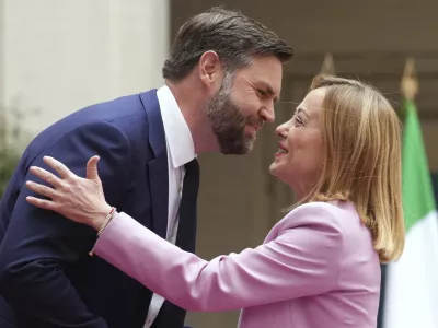 U.S. Vice President JD Vance, left, is welcomed by Italian Premier Giorgia Meloni as he arrives for talks at Palazzo Chigi government office in Rome, Friday, April 18, 2025. (AP Photo/Andrew Medichini)