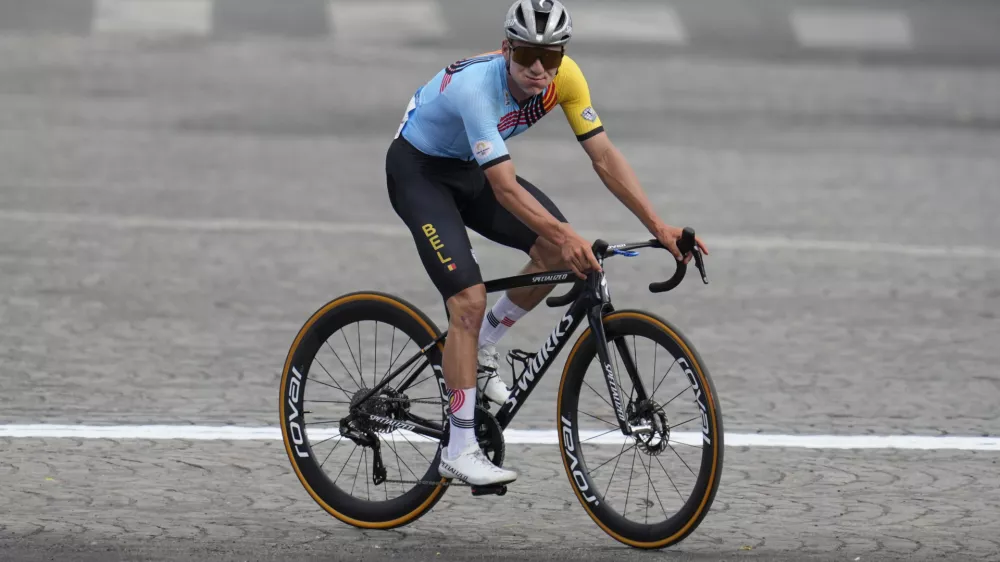 FILE -Remco Evenepoel, of Belgium, celebrates winning the men's road cycling event, at the 2024 Summer Olympics, Saturday, Aug. 3, 2024, in Paris, France. (AP Photo/Dar Yasin, File)