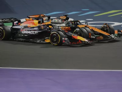 Red Bull driver Max Verstappen of the Netherlands, front, steers his car followed by McLaren driver Oscar Piastri of Australia during the Formula One Saudi Arabian Grand Prix at the Jeddah Corniche Circuit in Jeddah, Saudi Arabia, Sunday, April 20, 2025. (AP Photo/Darko Bandic)