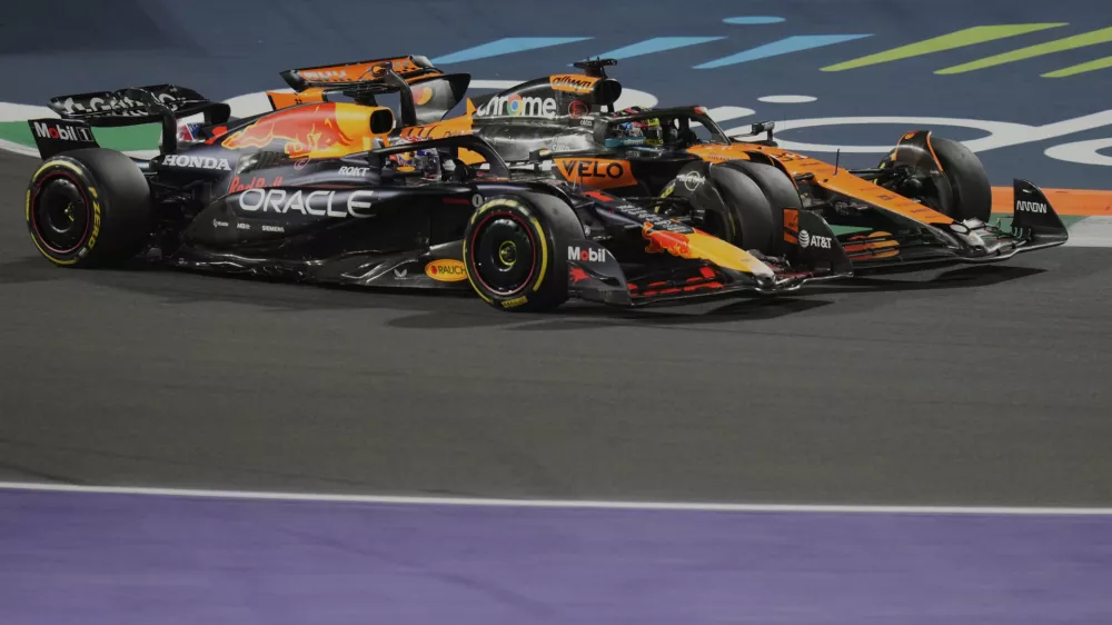 Red Bull driver Max Verstappen of the Netherlands, front, steers his car followed by McLaren driver Oscar Piastri of Australia during the Formula One Saudi Arabian Grand Prix at the Jeddah Corniche Circuit in Jeddah, Saudi Arabia, Sunday, April 20, 2025. (AP Photo/Darko Bandic)