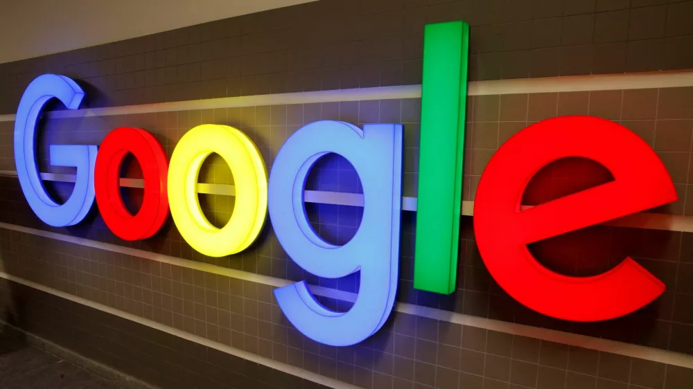 FILE PHOTO: An illuminated Google logo is seen inside an office building in Zurich, Switzerland, December 5, 2018. REUTERS/Arnd Wiegmann/File Photo