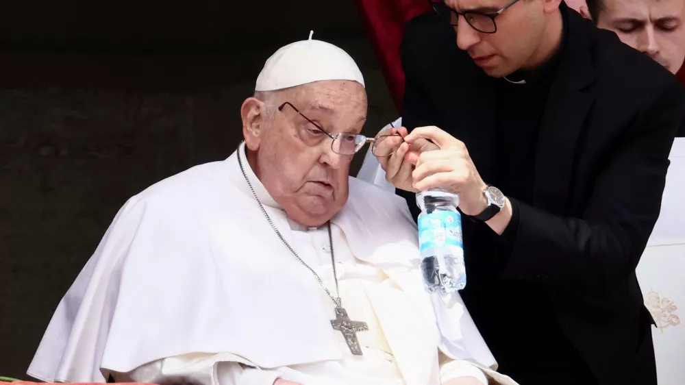 Pope Francis appears on a balcony on the day of the "Urbi et Orbi" (to the city and to the world) message, at St. Peter's Square, on Easter Sunday, in the Vatican, April 20, 2025. REUTERS/Yara Nardi