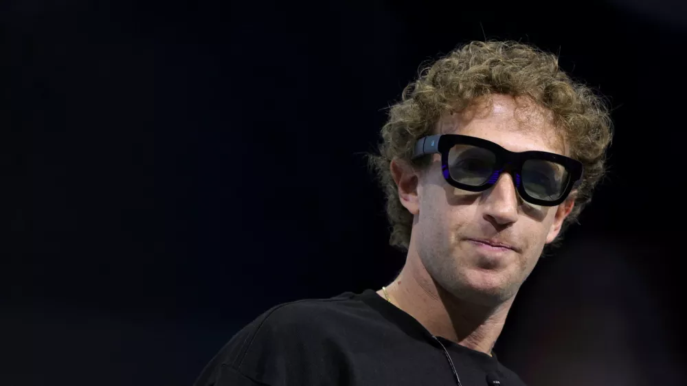 Meta CEO Mark Zuckerberg tries on Orion AR glasses at the Meta Connect annual event at the company's headquarters in Menlo Park, California, U.S., September 25, 2024. REUTERS/Manuel Orbegozo  TPX IMAGES OF THE DAY