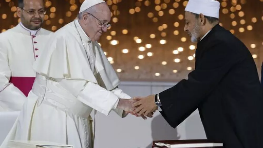 FILE - Pope Francis greets Sheikh Ahmed el-Tayeb, the grand imam of Egypt's Al-Azhar, after an Interreligious meeting at the Founder's Memorial in Abu Dhabi, United Arab Emirates, Wednesday, Feb. 4, 2015. (AP Photo/Andrew Medichini, file)