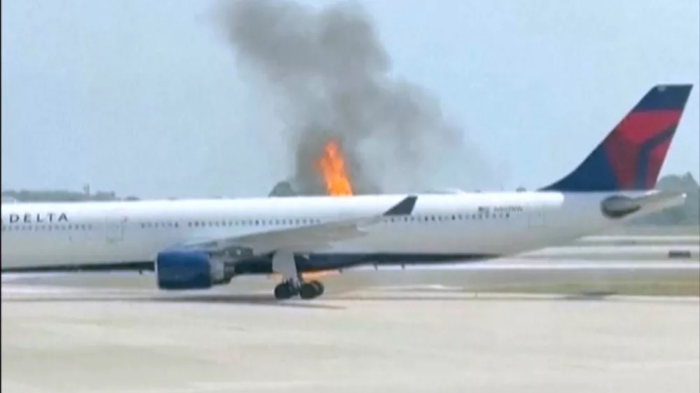 Flames rise from a Delta Air Lines airplane Monday, April 21, 2025, at the Orlando International Airport, in Orlando, Fla. (Dylan Wallace via AP)