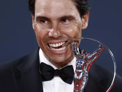 Laureus World Sports Awards - Palacio de Cibeles, Madrid, Spain - April 21, 2025 Spain former tennis player Rafael Nadal bites the sporting icon award after the ceremony REUTERS/Juan Medina
