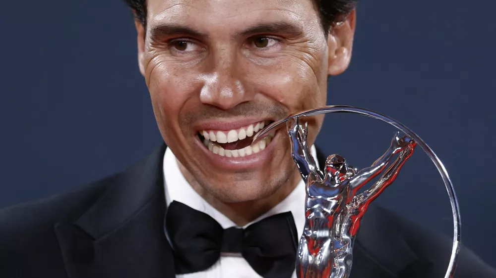 Laureus World Sports Awards - Palacio de Cibeles, Madrid, Spain - April 21, 2025 Spain former tennis player Rafael Nadal bites the sporting icon award after the ceremony REUTERS/Juan Medina