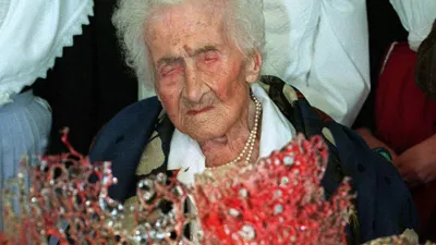 Jeanne Calment, believed to be the world's oldest person, receives a chocolate cake to celebrate her 122nd birthday in Arles, southern France Friday, Feb. 21, 1997. Two years ago, her doctor persuaded her to give up smoking, and she no longer indulges in the Sunday glass of Port wine. Calment has said olive oil is a key to her longevity. (AP Photo/Georges Gobet,Pool)
