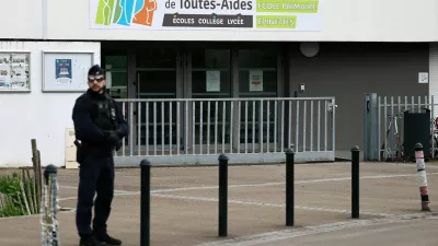 French police stands in front of the Notre-Dame-de-Toutes-Aides school after one high school student was killed and other students injured in a school stabbing, in Nantes, France, April 24, 2025. REUTERS/Stephane Mahe