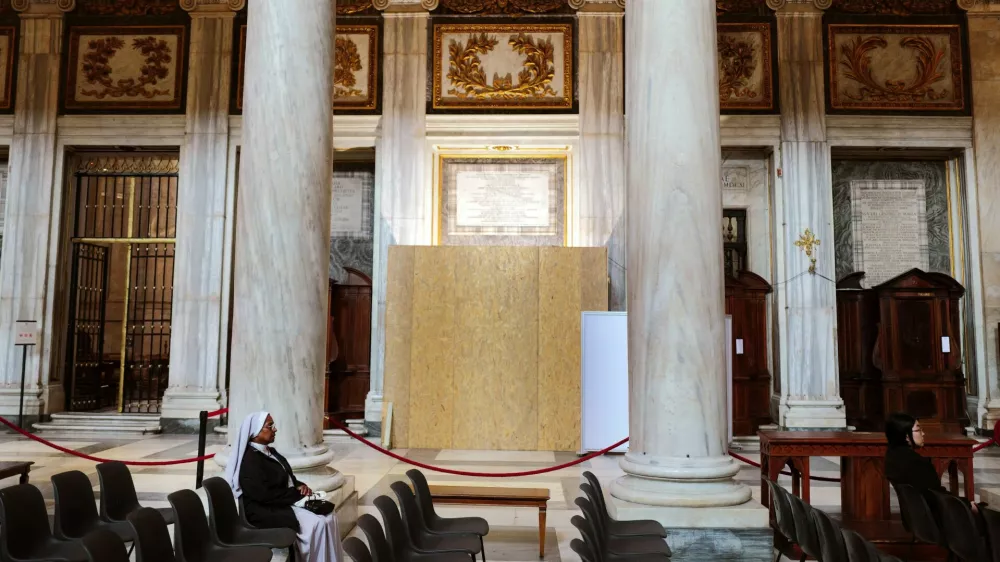 A nun prays near the site for the tomb of Pope Francis, inside the Papal Basilica of Saint Mary Major (Santa Maria Maggiore), a day before his funeral, in Rome, Italy, April 25, 2025. REUTERS/Kai Pfaffenbach