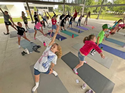 Children in the 2024 Art Exploration Summer Camp at the Mansfield Art Center participate in dance and musical lessons Tuesday morning. Each day, children create projects that combine artistic expression with scientific inquiry and technological innovation. The weeklong summer camps run through Aug. 9.