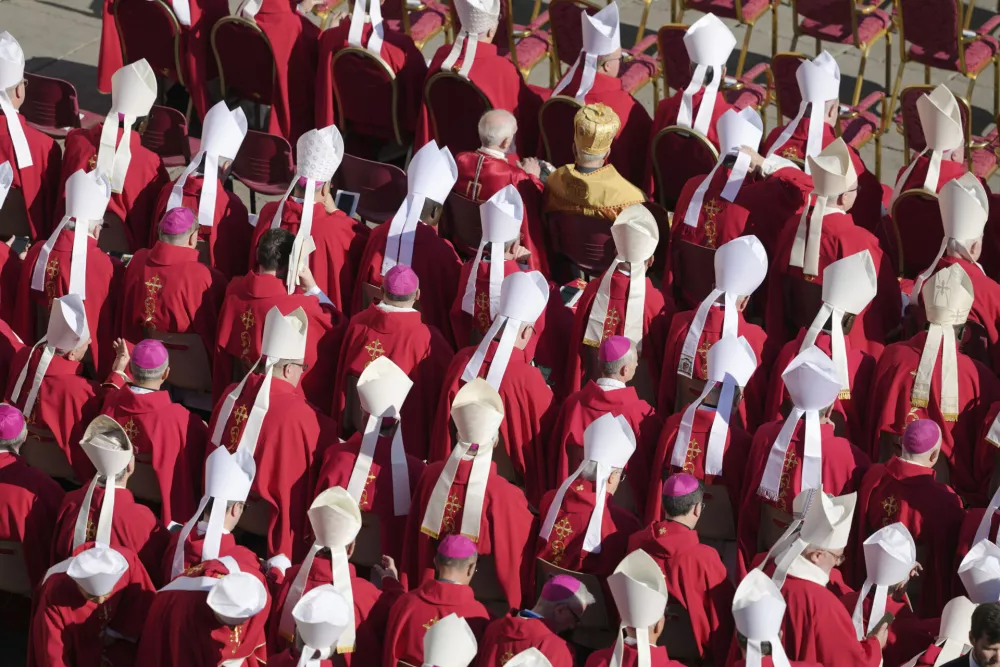 Clergy take their seats ahead of the funeral of Pope Francis in St. Peter's Square at the Vatican, Saturday, April 26, 2025. (AP Photo/Markus Schreiber)
