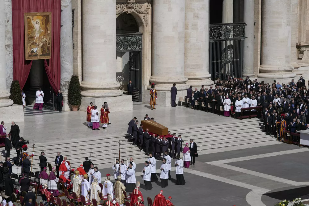 The coffin of Pope Francis is carried into St Peter's Square for his funeral, at the Vatican, Saturday, April 26, 2025. (AP Photo/Gregorio Borgia)
