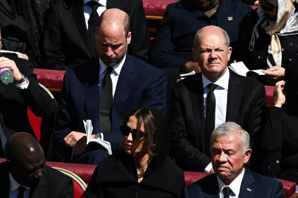 Britain's Prince William, German Chancellor Olaf Scholz, Jordan's King Abdullah and Queen Rania attend the funeral Mass of Pope Francis in St. Peter's Square at the Vatican, April 26, 2025. REUTERS/Dylan Martinez
