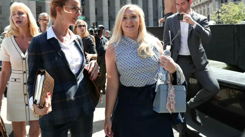FILE PHOTO: Virginia Giuffre, an alleged victim of Jeffrey Epstein, walks after the hearing in the criminal case against Epstein, who died this month in what a New York City medical examiner ruled a suicide, at Federal Court in New York, U.S., August 27, 2019. REUTERS/Shannon Stapleton/File Photo
