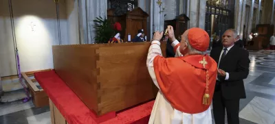Cardinal Camerlengo Kevin Joseph Farrell puts a seal on the coffin of late Pope Francis during the burial ceremony inside St. Mary Major Basilica in Rome Saturday, April 26, 2025. (Vatican Media via AP)