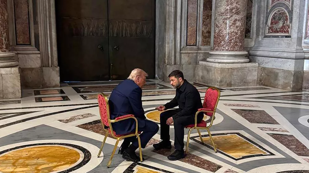In this photo provided by the Ukrainian Presidential Press Office, Ukraine's President Volodymyr Zelenskyy, right, and President Donald Trump, talk as they attend the funeral of Pope Francis in Vatican, Saturday, April 26, 2025.(Ukrainian Presidential Press Office via AP)