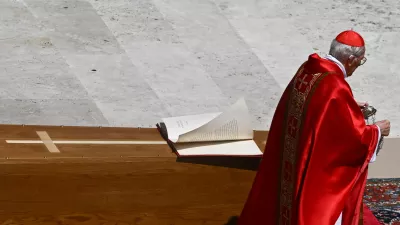 Cardinal Giovanni Battista Re blesses the coffin as he leads the funeral Mass of Pope Francis, in Saint Peter's Square, at the Vatican, April 26, 2025. REUTERS/Dylan Martinez