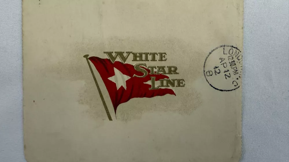 This undated handout picture provided by the auctioneers Henry Aldridge & Son, England, shows a lettercard, penned by one of the Titanic's most well-known survivors from onboard the ship days before it sank, which has sold for 300,000 pounds ($399,000) at auction. (Henry Aldridge & Son via AP)