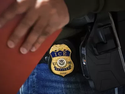 FILE - A deportation officer with Enforcement and Removal Operations in U.S. Immigration and Customs Enforcement's New York City field office conducts a brief before an early morning operation, Tuesday, Dec. 17, 2024, in the Bronx borough of New York. (AP Photo/Julia Demaree Nikhinson, File)