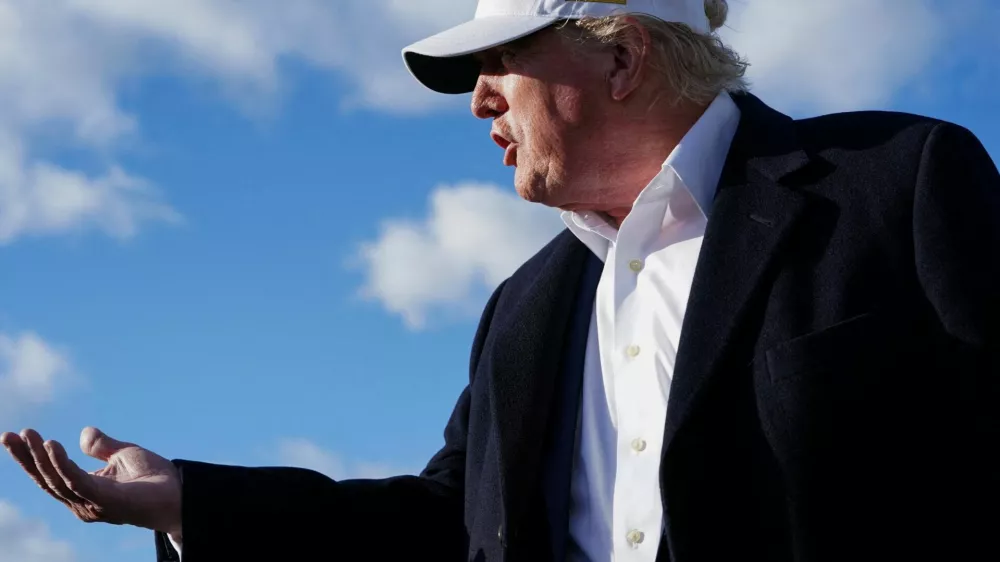 U.S. President Donald Trump gestures as he speaks to the media before boarding Air Force One en route to Washington, D.C, at Morristown Municipal Airport in Morristown, New Jersey, U.S., April 27, 2025. REUTERS/Nathan Howard   TPX IMAGES OF THE DAY