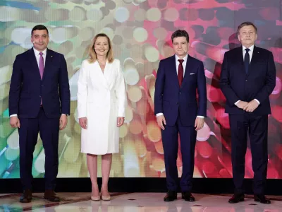 Presidential candidates George Simion, Elena Lasconi, Nicusor Dan and Crin Antonescu pose for a family photo at the start of a presidential debate hosted by Digi24 TV station in Bucharest, Romania, April 28, 2025. Inquam Photos/Octav Ganea via REUTERS ATTENTION EDITORS - THIS IMAGE WAS PROVIDED BY A THIRD PARTY. ROMANIA OUT. NO COMMERCIAL OR EDITORIAL SALES IN ROMANIA