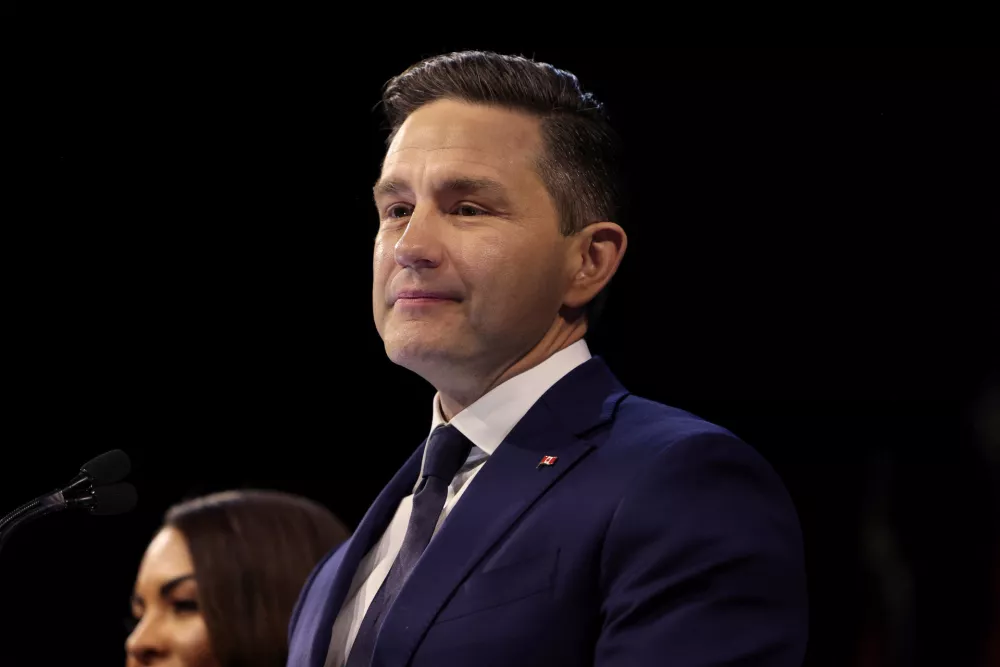 Conservative party leader Pierre Poilievre speaks to supporters alongside his wife Anaida Poilievre after the election was declared for the Liberal Party in Ottawa, Ontario, Canada April 29, 2025. REUTERS/Amber Bracken