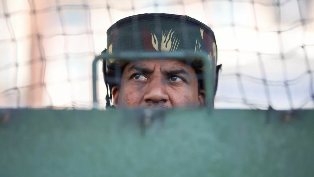 An Indian security force personnel stands guard on a street, following a suspected militant attack near south Kashmir's Pahalgam, in Srinagar, April 28, 2025. REUTERS/Adnan Abidi