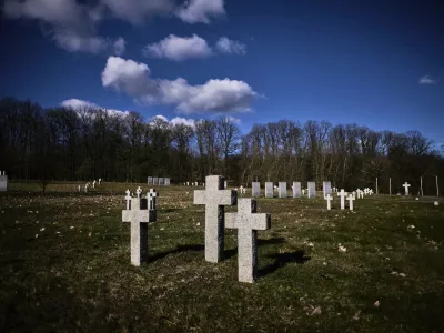Crosses and grave stones stand on a war cemetery for more than 26.000 fallen German WWII soldiers in Stare Czarnowo, near Szczecin, Poland, Monday, March 17, 2025. (AP Photo/Markus Schreiber)