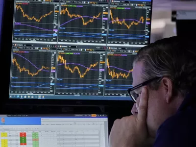 Specialist Gregg Maloney works at his post on the floor of the New York Stock Exchange, Monday, April 28, 2025. (AP Photo/Richard Drew)