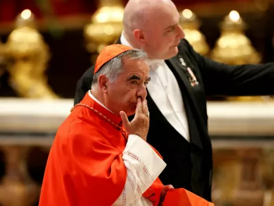 FILE PHOTO: Cardinal Angelo Becciu arrives at a consistory ceremony to elevate Roman Catholic prelates to the rank of cardinal, at Saint Peter's Basilica at the Vatican, August 27, 2022. REUTERS/Remo Casilli/File Photo