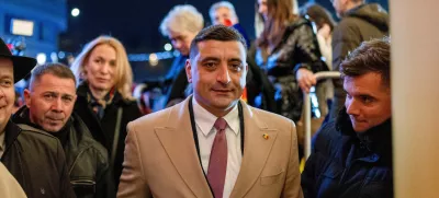 FILE PHOTO: The leader of the radical right Alliance for Uniting Romanians (AUR) party, George Simion, looks on following initial exit polls at the party's campaign headquarters on the day of the parliamentary election, in Bucharest, Romania, December 1, 2024. REUTERS/Alkis Konstantinidis/File Photo